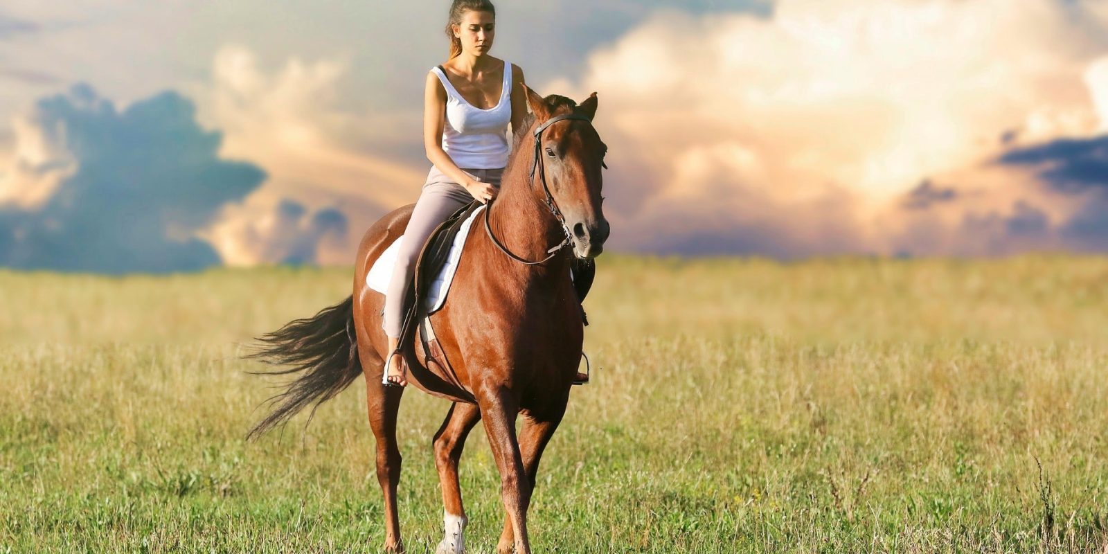 Girl riding horse in Tuscany