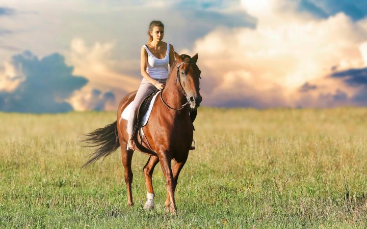 Girl riding horse in Tuscany